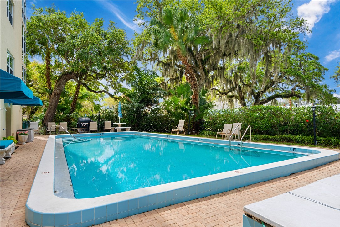 275 Date Palm Road, Unit 403 Vero Beach, FL 32963 - Photo 24 of 35 a view of a swimming pool with a patio