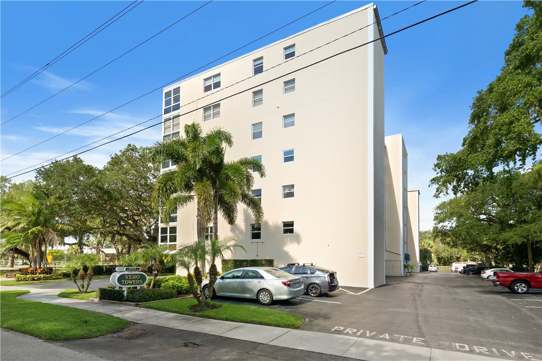 275 Date Palm Road, Unit 403 Vero Beach, FL 32963 - Photo 26 of 35 a car parked in front of a building