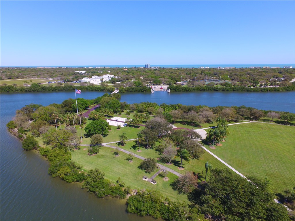 275 Date Palm Road, Unit 403 Vero Beach, FL 32963 - Photo 31 of 35 an aerial view of ocean with residential houses with outdoor space and trees