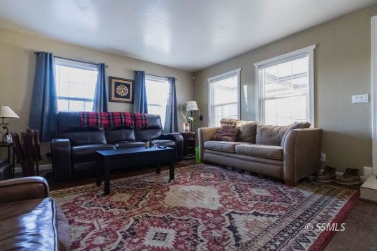 925 West St George Avenue Ridgecrest, CA 93555 - Photo 8 of 24 a living room with furniture and a rug