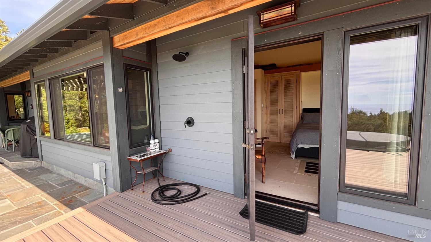 34478 Iversen Road Gualala, CA 95445 - Photo 33 of 43 Primary bedroom opens to the spa deck and outdoor shower.