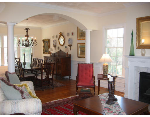 30 Battle Flagg Road Bedford, MA 01730 - Photo 3 of 9 a living room with furniture a fireplace and a chandelier
