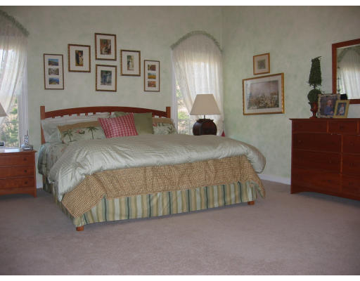 30 Battle Flagg Road Bedford, MA 01730 - Photo 6 of 9 a bedroom with a bed and a dresser