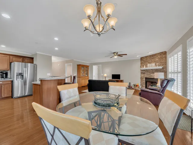a living room with fireplace furniture and a wooden floor