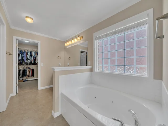 a bathroom with a bathtub and a sink