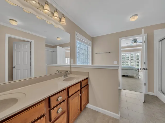 a bathroom with a sink double vanity and a mirror