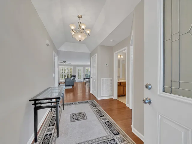 a very nice looking dining room with a table and chairs