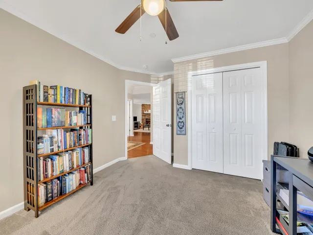 a view of a bedroom with furniture and staircase