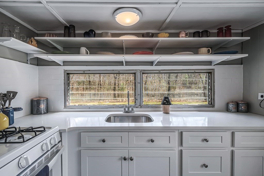 95 Better Way Springfield, MA 01119 - Photo 1 of 39 a kitchen with a window a sink and a counter top space