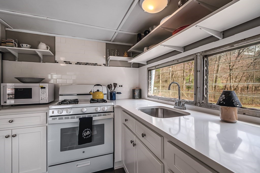 95 Better Way Springfield, MA 01119 - Photo 3 of 39 a kitchen with stainless steel appliances granite countertop a sink a stove and cabinets