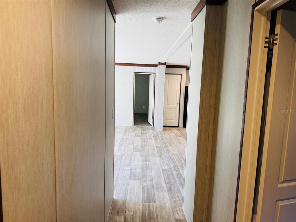 16226 41st Place Wellborn, FL 32094 - Photo 13 of 18 a view of a hallway with wooden floor