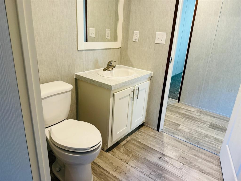 16226 41st Place Wellborn, FL 32094 - Photo 18 of 18 a bathroom with a sink and a toilet