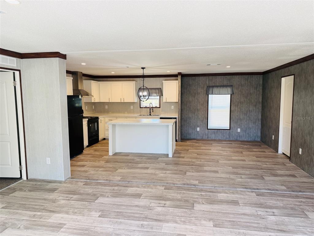 16226 41st Place Wellborn, FL 32094 - Photo 6 of 18 a view of a kitchen with a sink cabinets and a window
