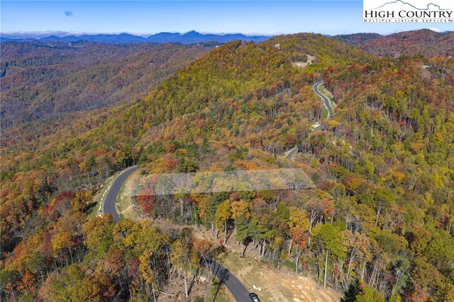 a view of residential houses and mountain view