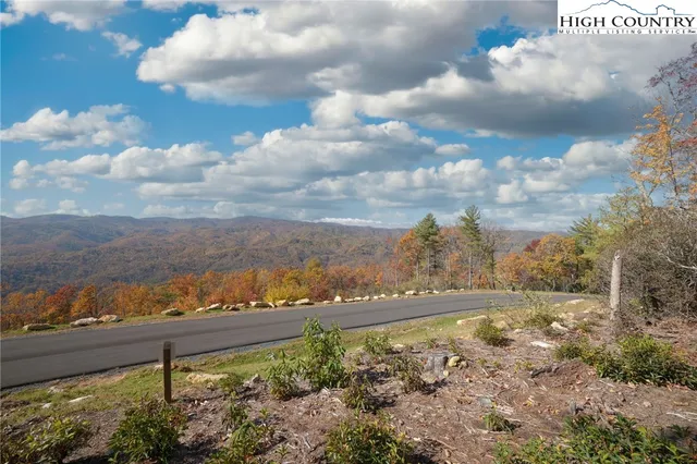 a view of a yard with an ocean view