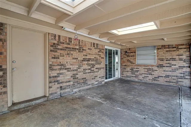 a view of an empty room with a fireplace