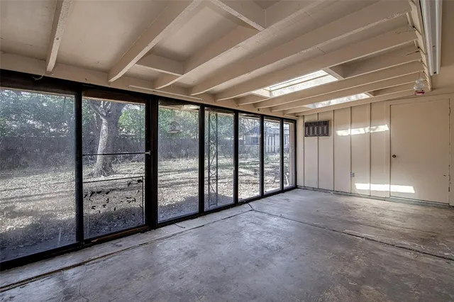 a view of an empty room with a balcony