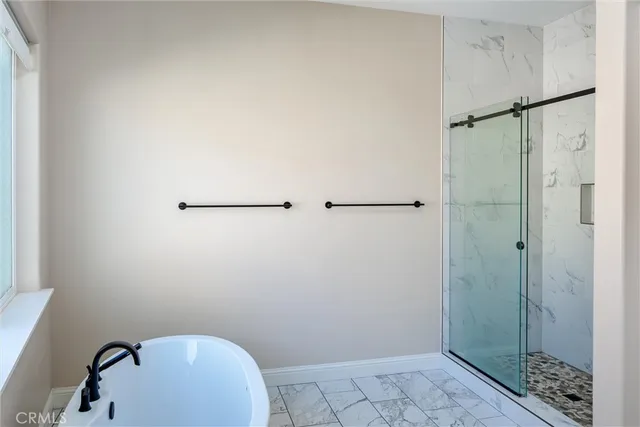 a bathroom with a shower and toilet