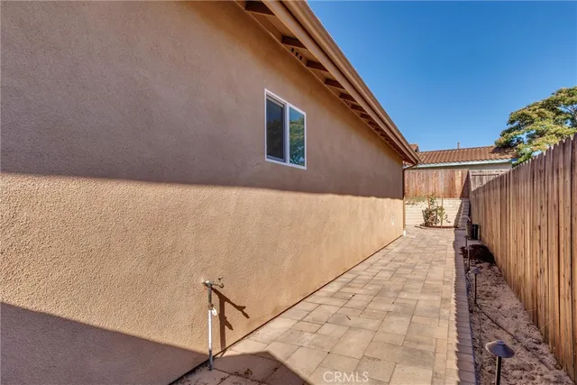 a view of backyard with wooden floor and fence