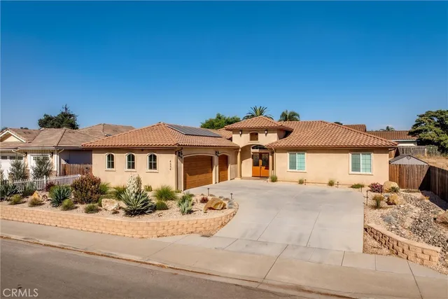 a front view of a house with yard