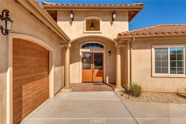 a front view of a house with large windows