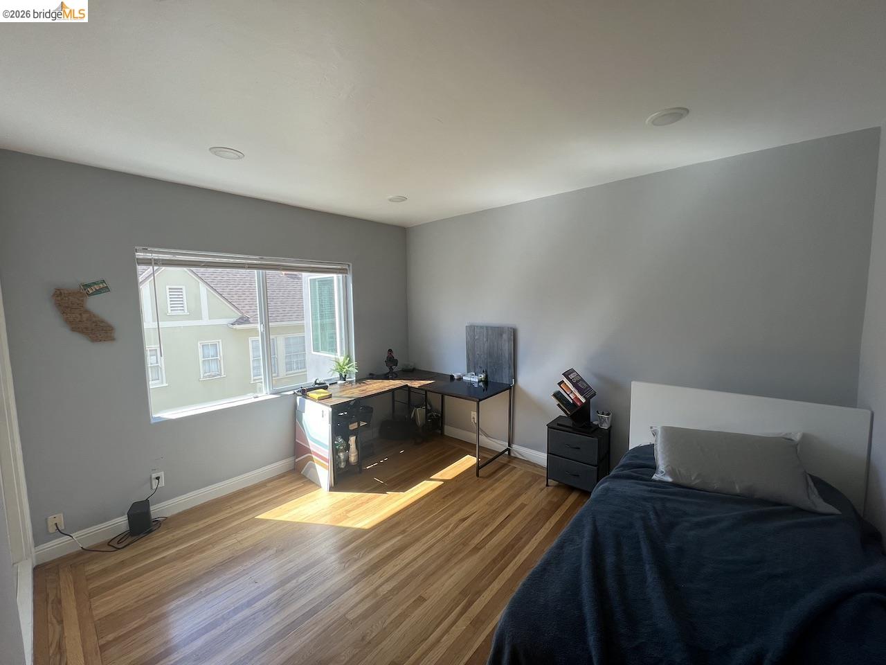 2554 Virginia Street Berkeley, CA 94709 - Photo 2 of 6 a bed room with a bed and a window