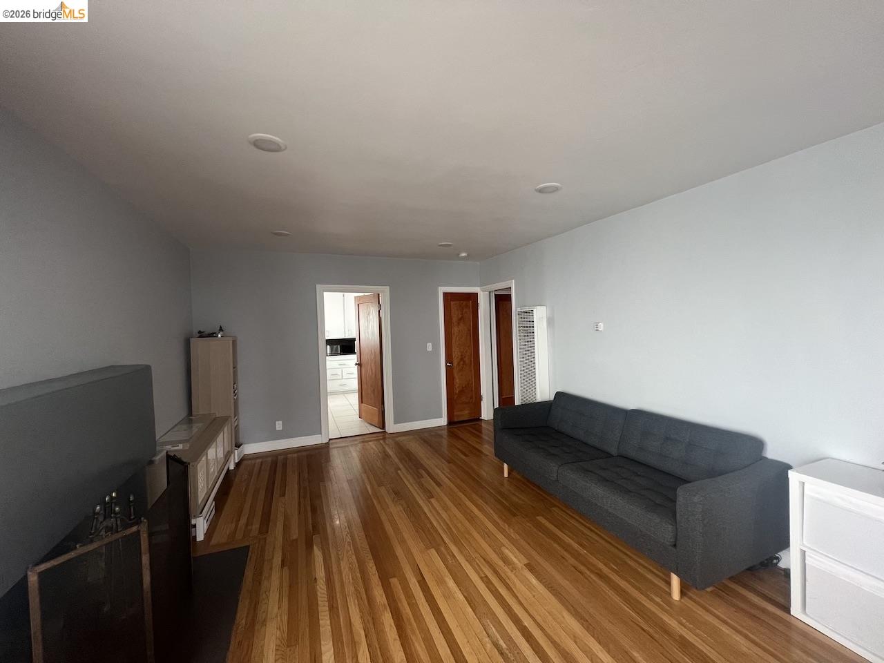 2554 Virginia Street Berkeley, CA 94709 - Photo 3 of 6 a living room with furniture and a wooden floor