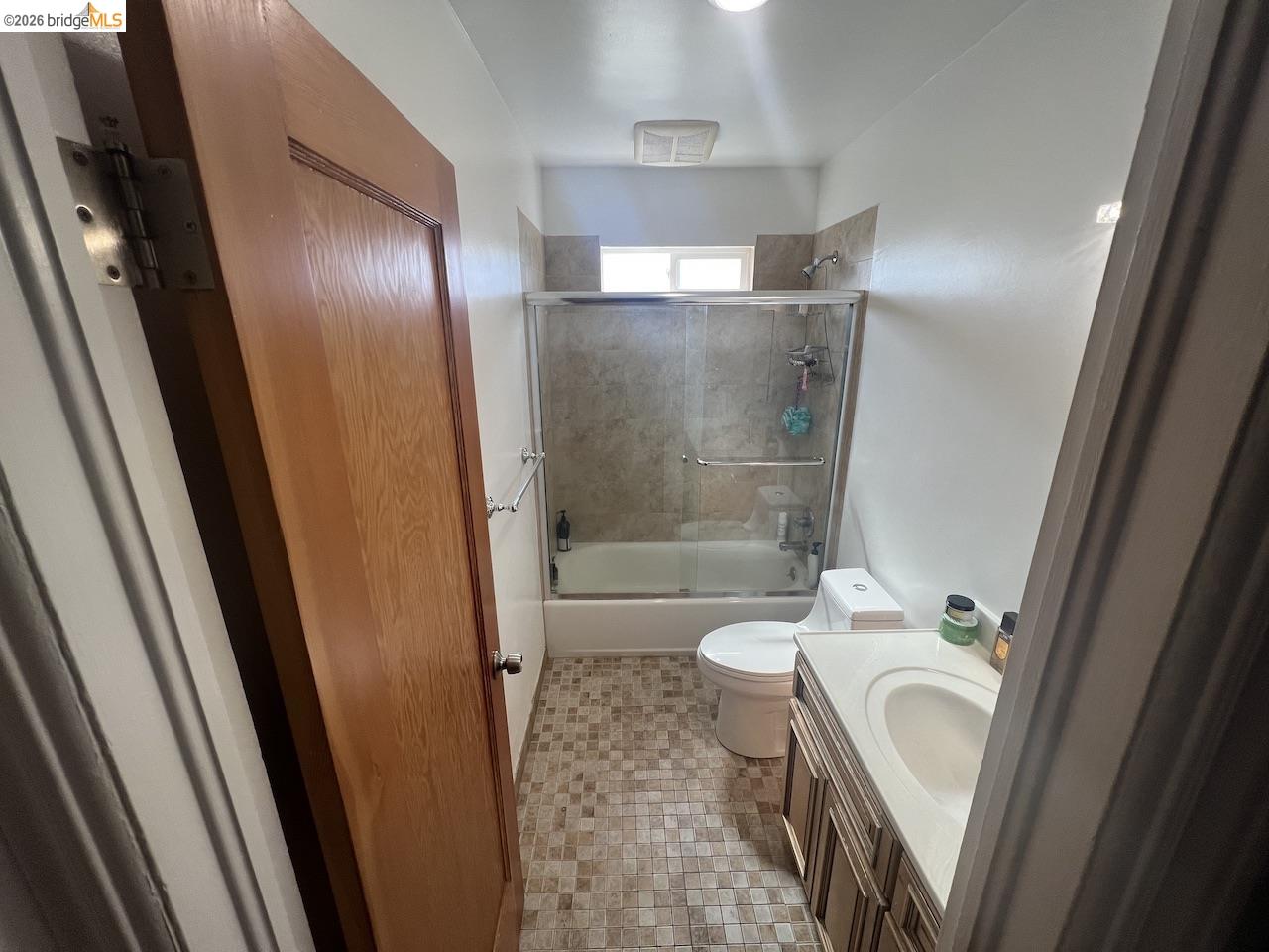 2554 Virginia Street Berkeley, CA 94709 - Photo 5 of 6 a bathroom with a sink and mirror with bathtub