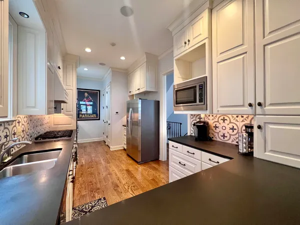 a view of a kitchen with a sink and dishwasher