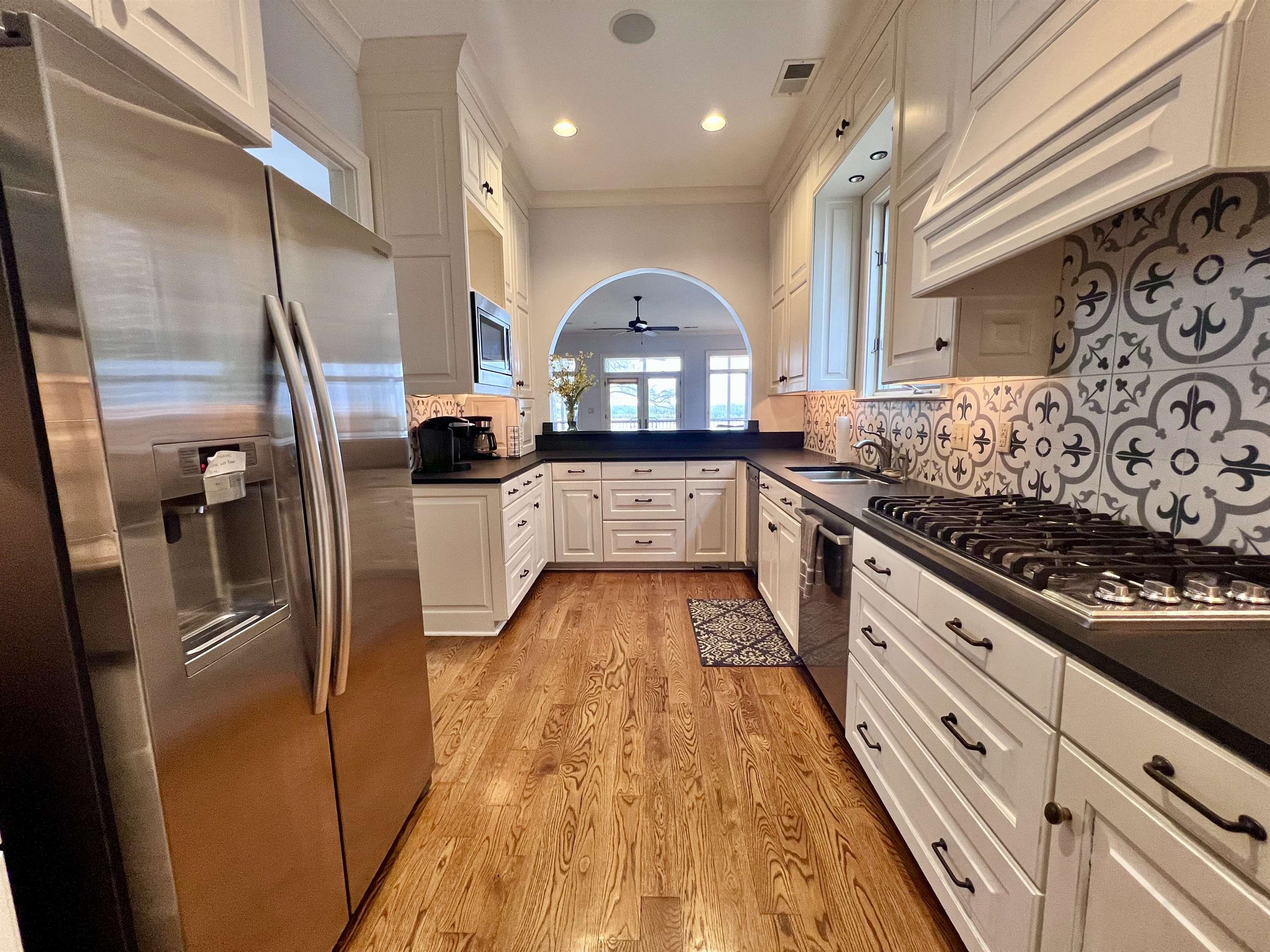 481 Tennessee Street Memphis, TN 38103 - Photo 26 of 40 a view of a kitchen with a sink and refrigerator