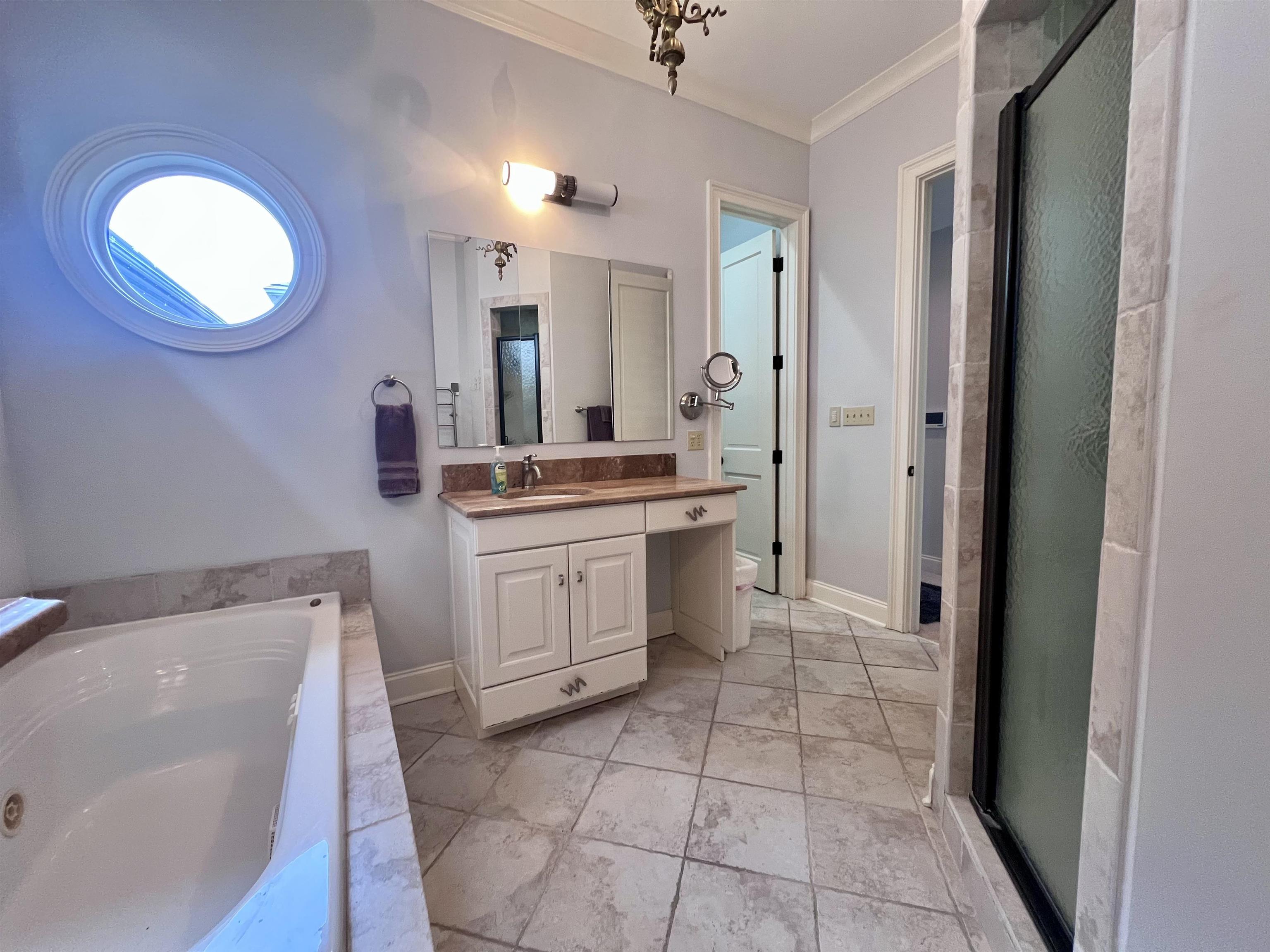 481 Tennessee Street Memphis, TN 38103 - Photo 9 of 40 a bathroom with a sink a vanity and a mirror