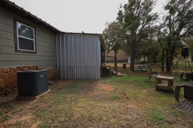 a view of a backyard with sitting area