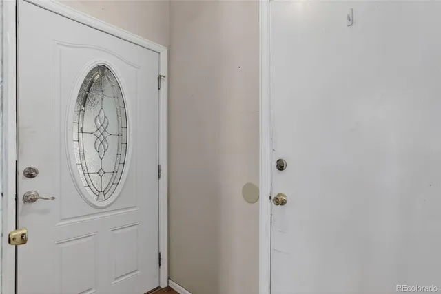 a bathroom with a large mirror and a shower