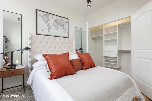 a bedroom with a bed and a view of bathroom