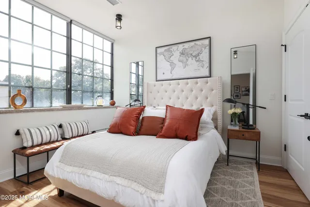 a bedroom with a large bed and a window