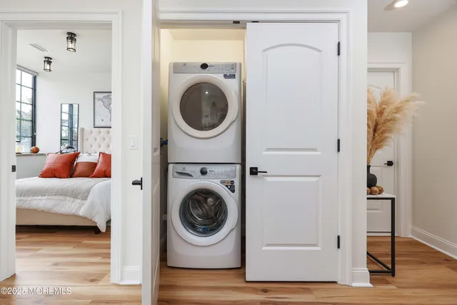 a view of a hallway with washer and dryer