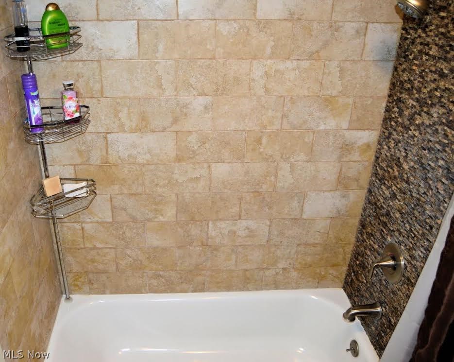 1251 Shields Road Youngstown, OH 44511 - Photo 12 of 24 Tub/Shower features Tile/Stone surround, New Faucet/Shower Head.