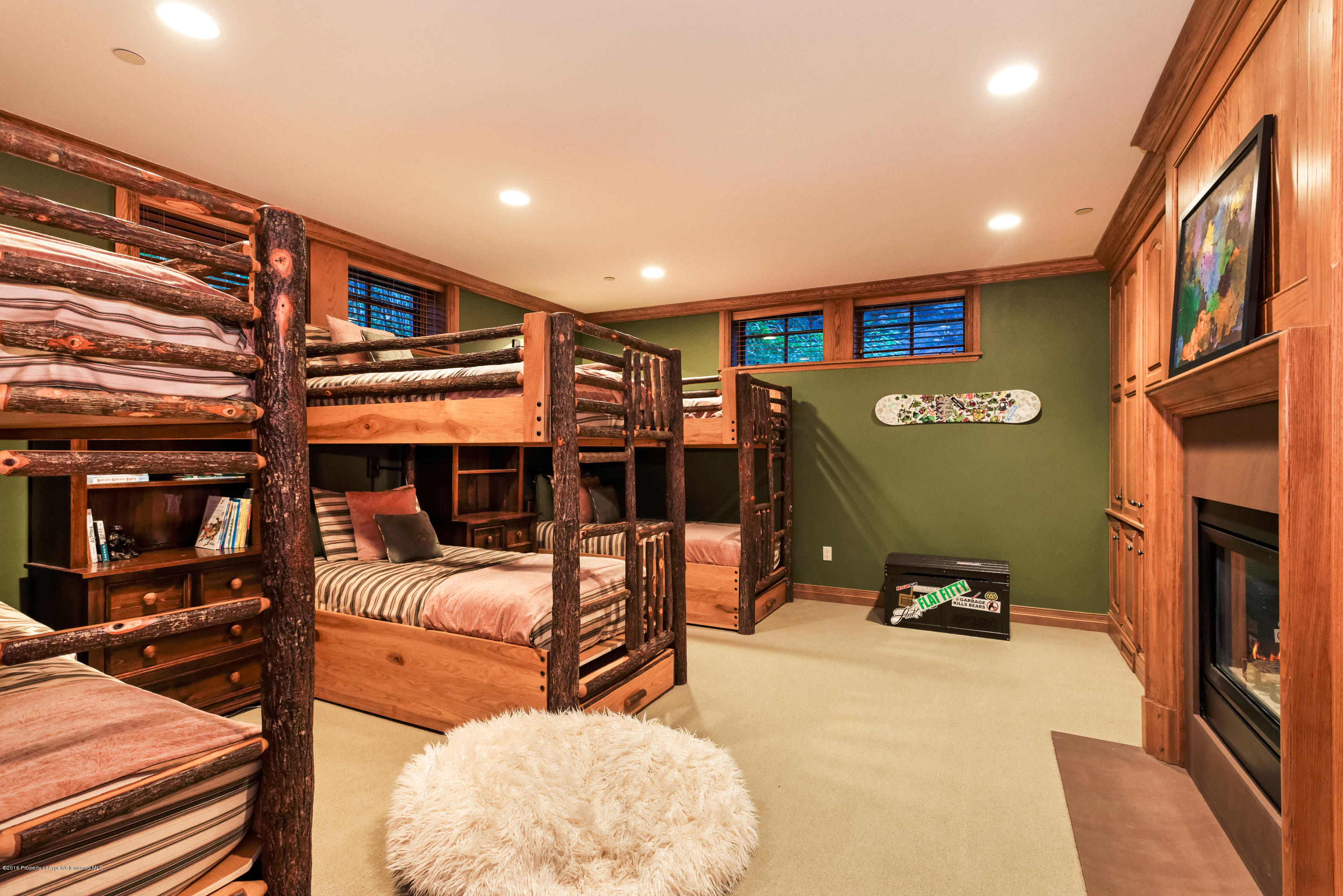 1205 Tiehack Road Aspen, CO 81611 - Photo 11 of 23 a view of a livingroom with furniture and a flat screen tv