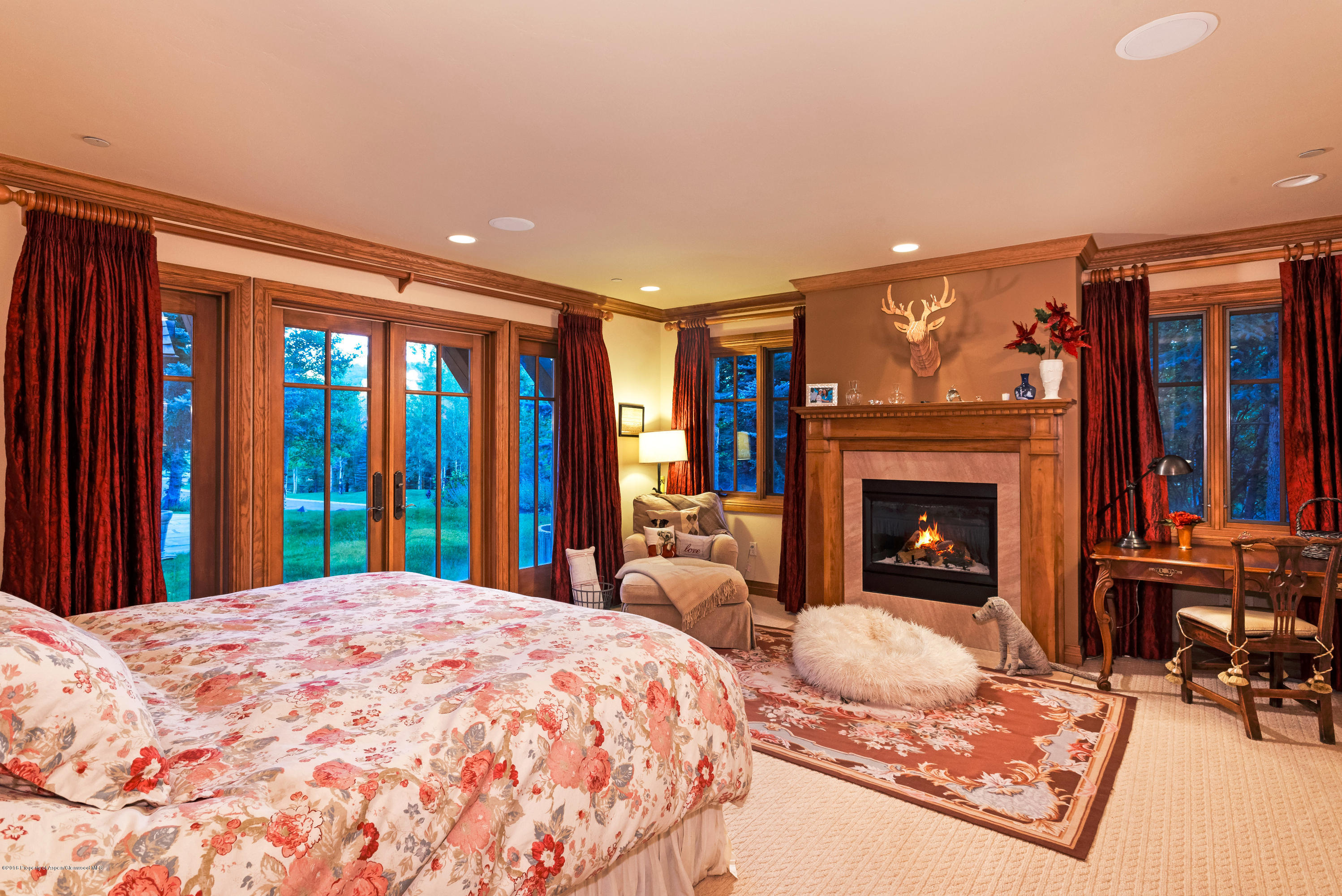 1205 Tiehack Road Aspen, CO 81611 - Photo 12 of 23 a bed room with a bed and a fireplace