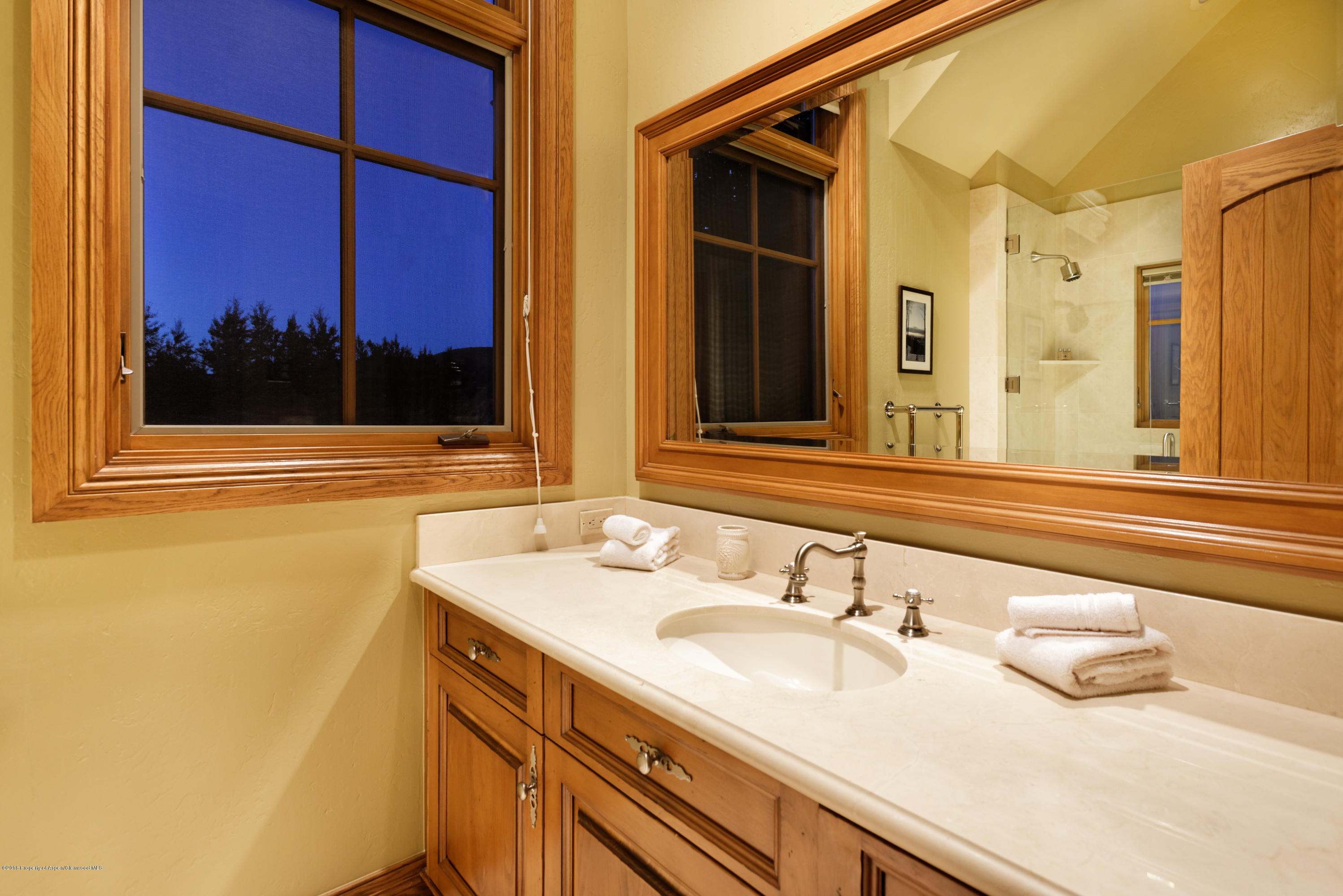 1205 Tiehack Road Aspen, CO 81611 - Photo 15 of 23 a bathroom with a sink and a mirror