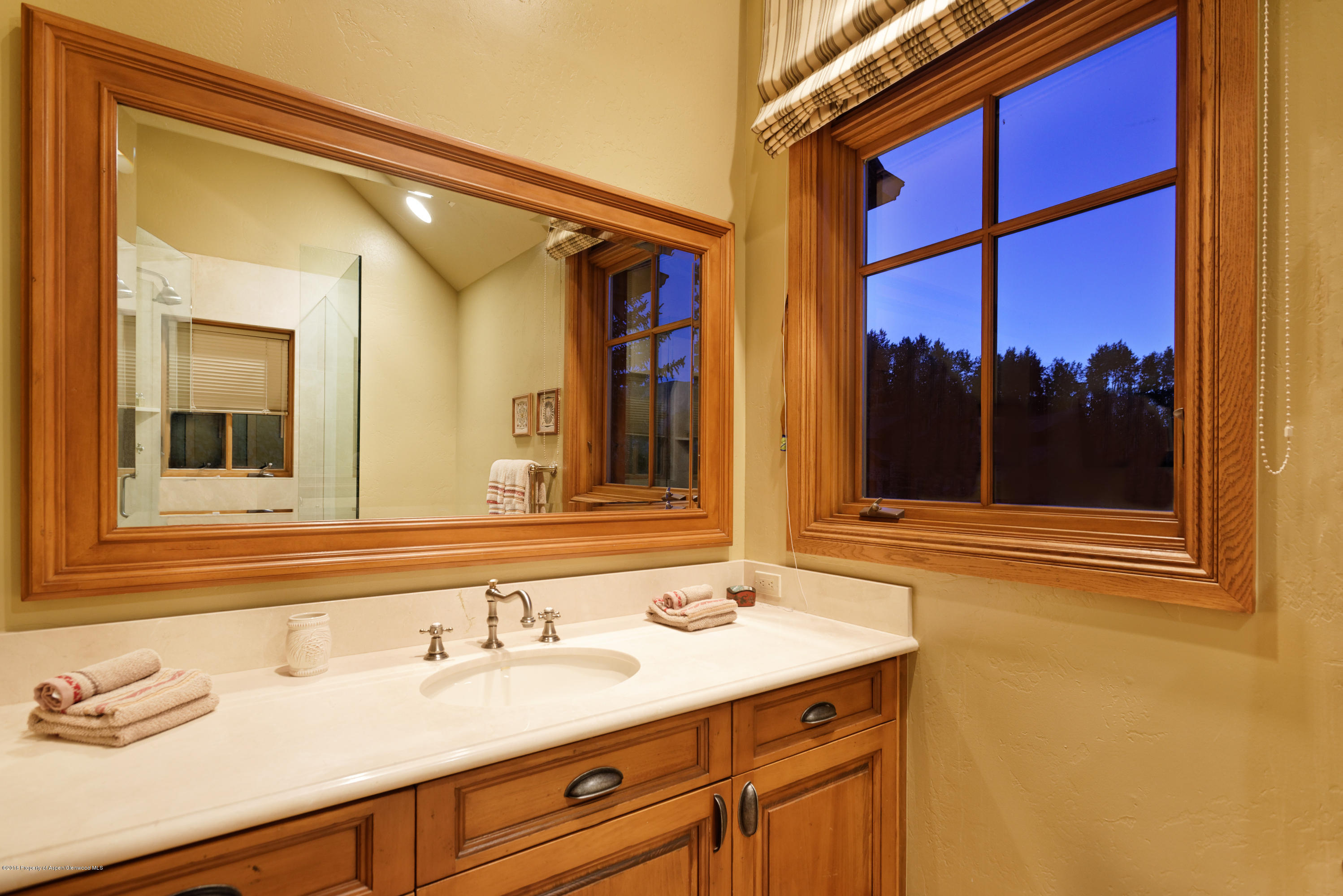 1205 Tiehack Road Aspen, CO 81611 - Photo 17 of 23 a bathroom with a sink and a mirror