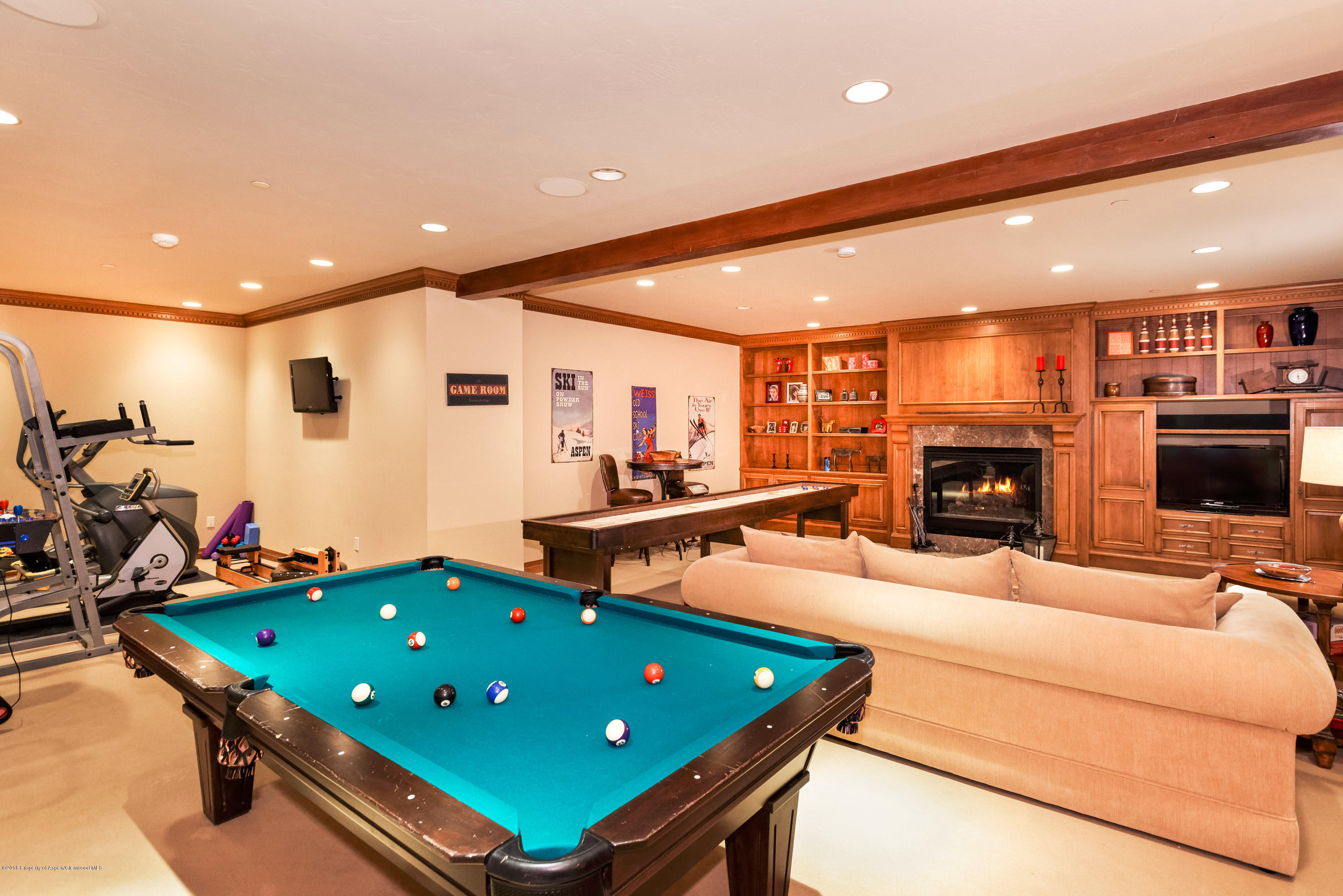 1205 Tiehack Road Aspen, CO 81611 - Photo 21 of 23 a room with furniture a flat screen tv and a table