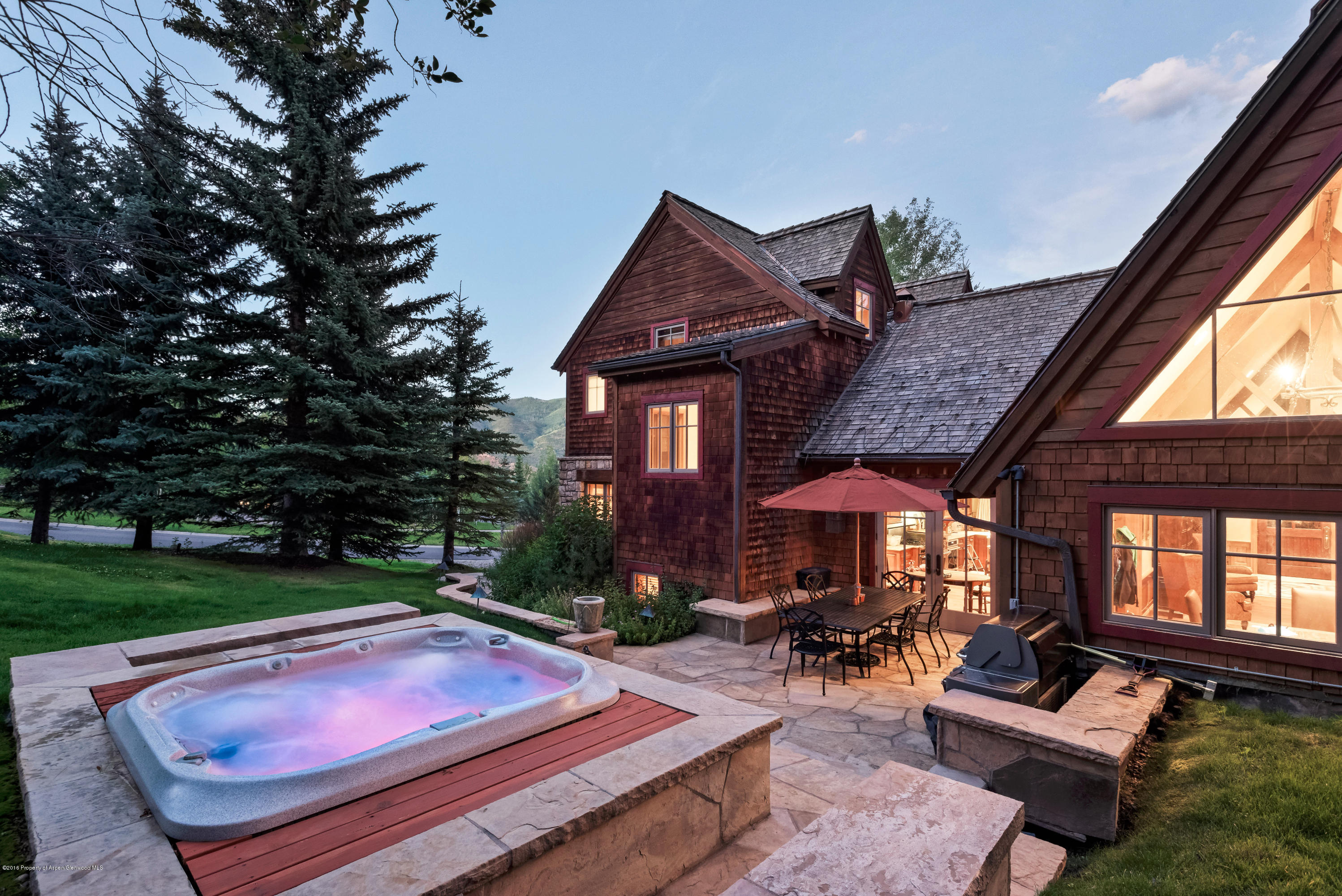 1205 Tiehack Road Aspen, CO 81611 - Photo 22 of 23 a view of patio with a table and chairs under an umbrella