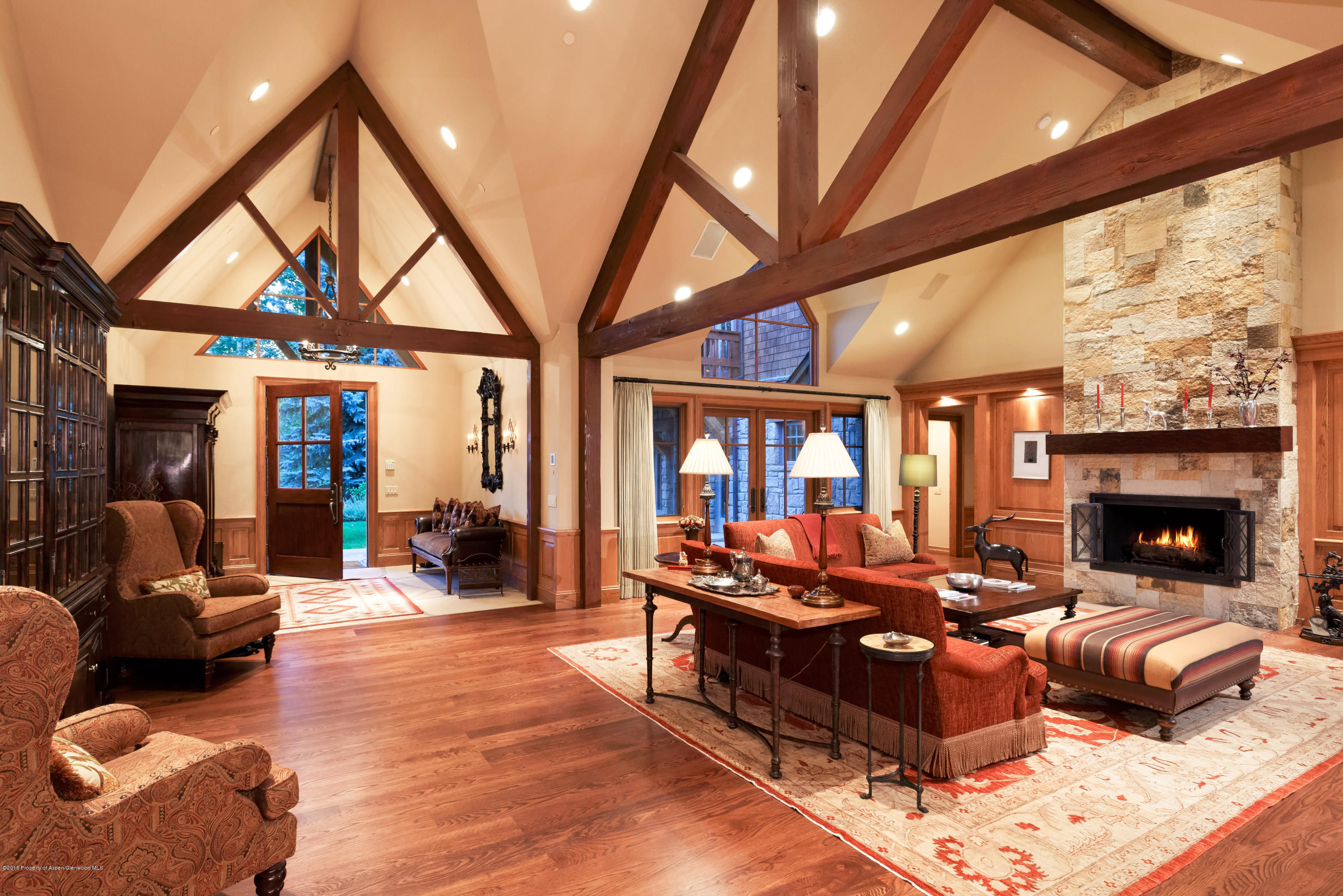1205 Tiehack Road Aspen, CO 81611 - Photo 3 of 23 a living room with furniture a fireplace and a large window