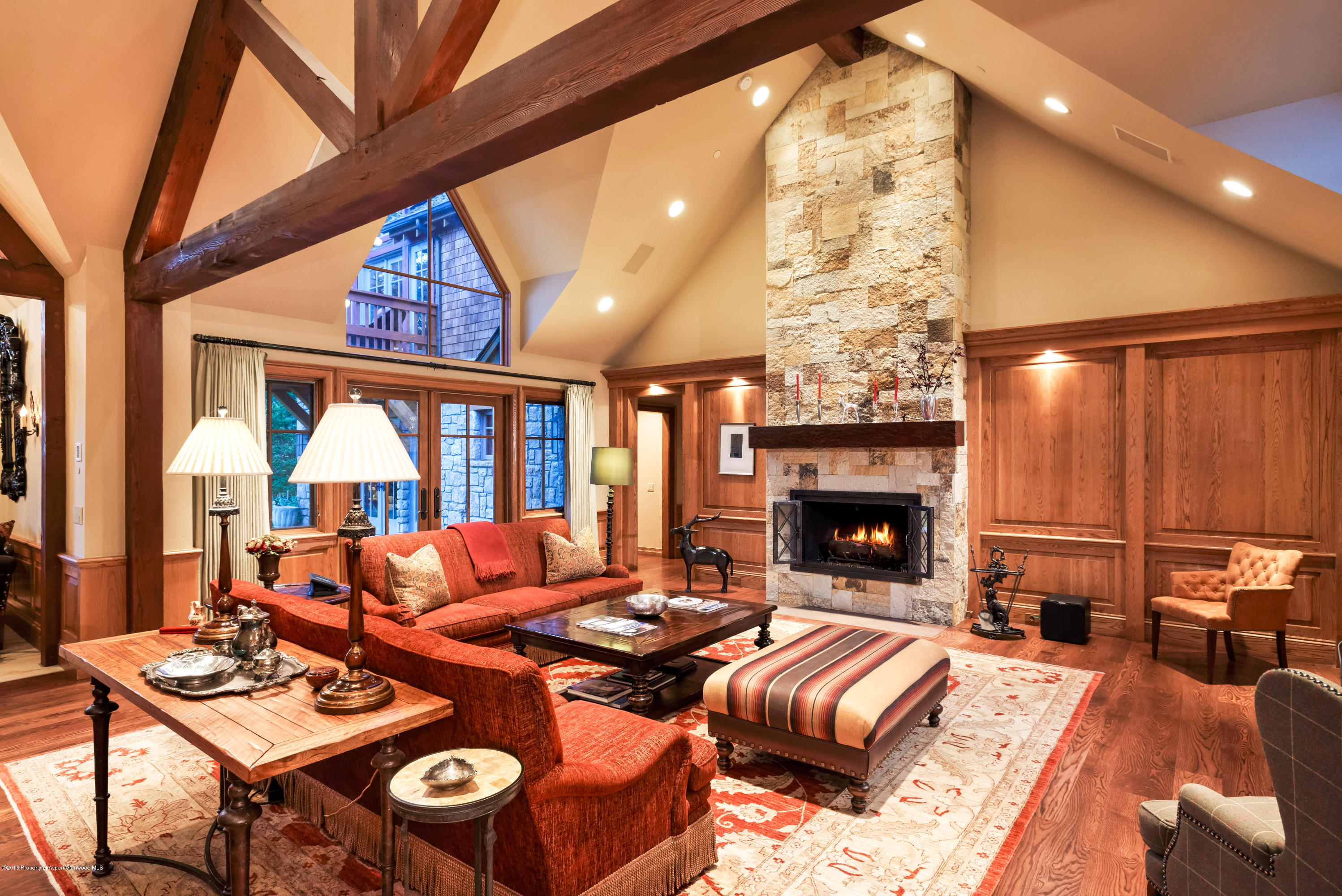 1205 Tiehack Road Aspen, CO 81611 - Photo 4 of 23 a living room with furniture a fireplace and a large window