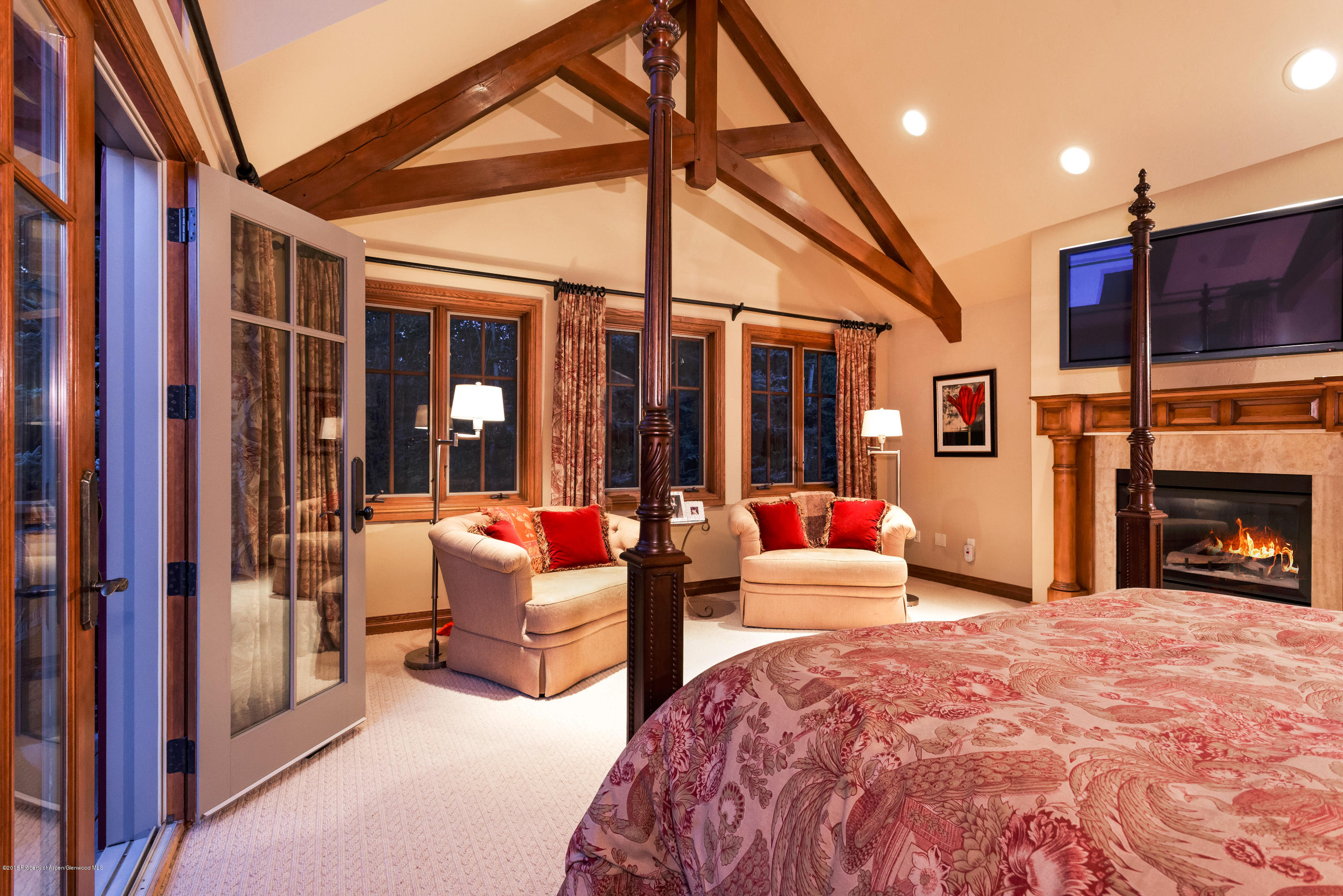 1205 Tiehack Road Aspen, CO 81611 - Photo 6 of 23 a bedroom with furniture and large windows