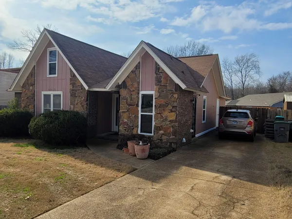 a car parked in front of a house