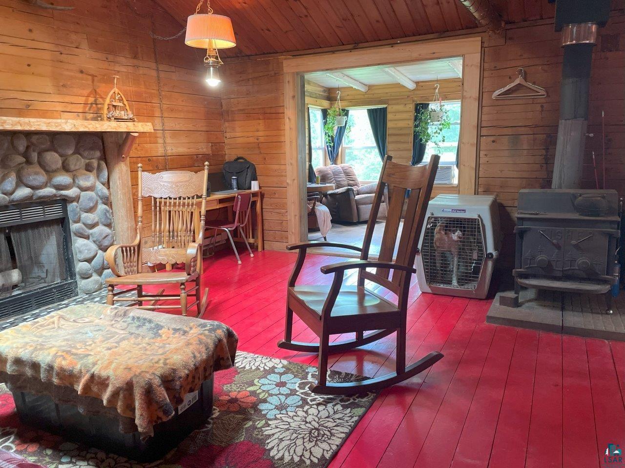 3420 Dewees Road Babbitt, MN 55706 - Photo 15 of 58 Living room expands into the 4 season sunroom.