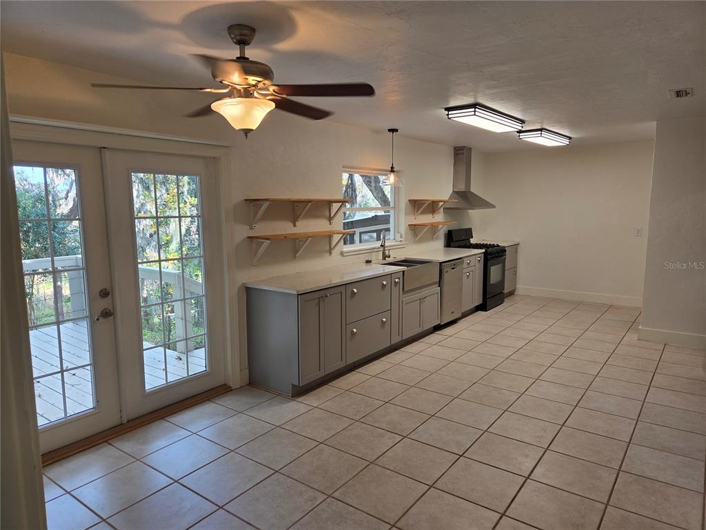 2901 Southwest 4 Court Gainesville, FL 32601 - Photo 34 of 58 a kitchen with a sink cabinets and appliances