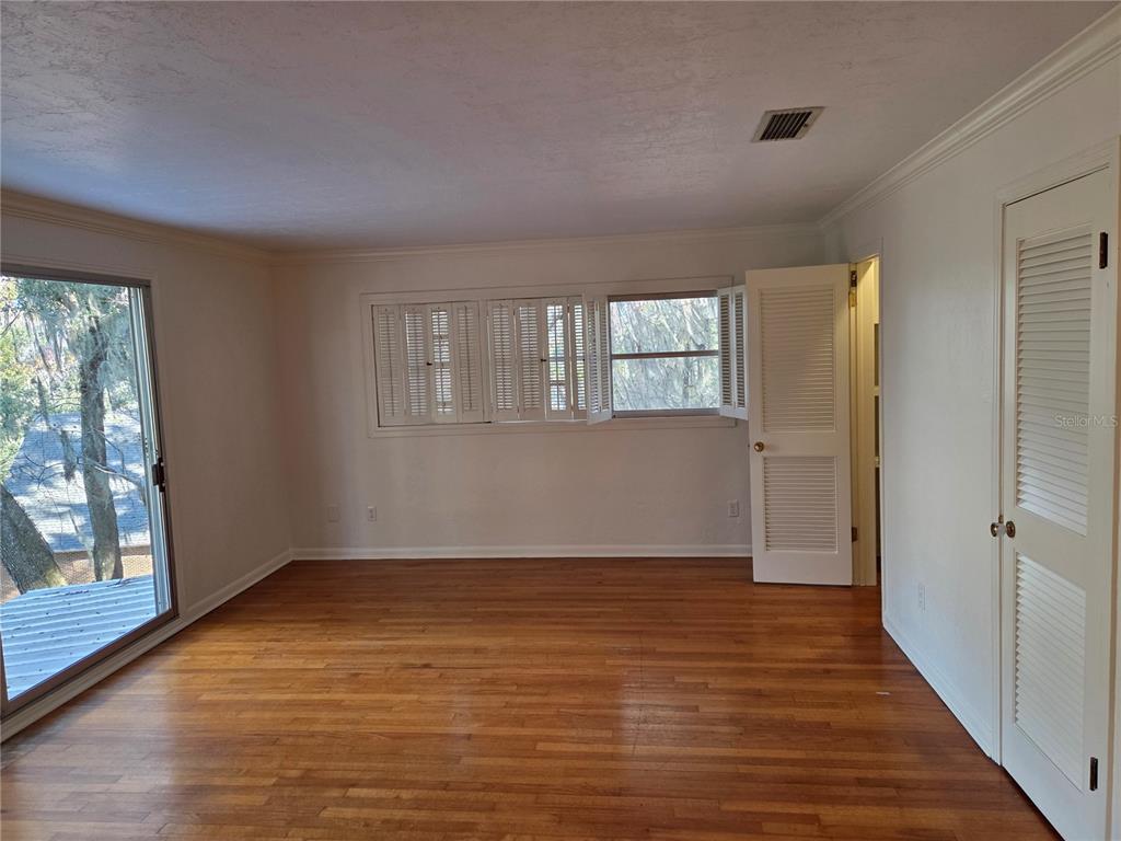 2901 Southwest 4 Court Gainesville, FL 32601 - Photo 47 of 58 wooden floor in an empty room with a window